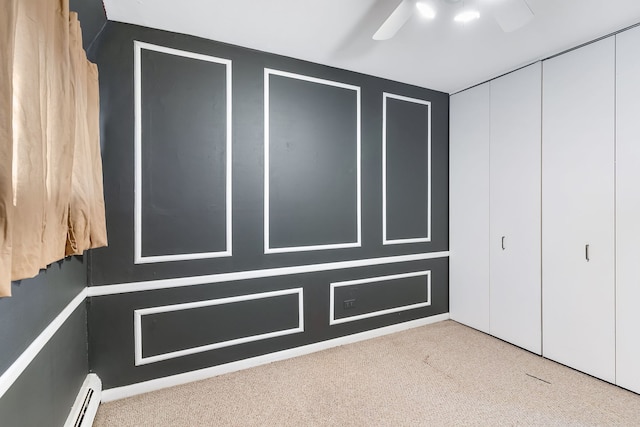 1733 N Larrabee St Unit 0, Chicago, IL 60614 - unfurnished bedroom featuring ceiling fan, a baseboard heating unit, and carpet floors