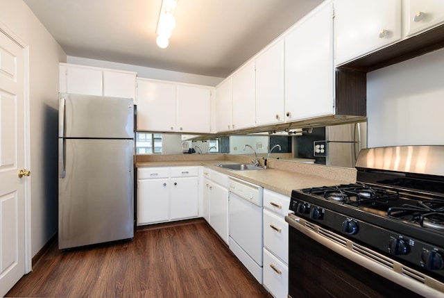 kitchen featuring white cabinets, dark hardwood / wood-style flooring, sink, and appliances with stainless steel finishes