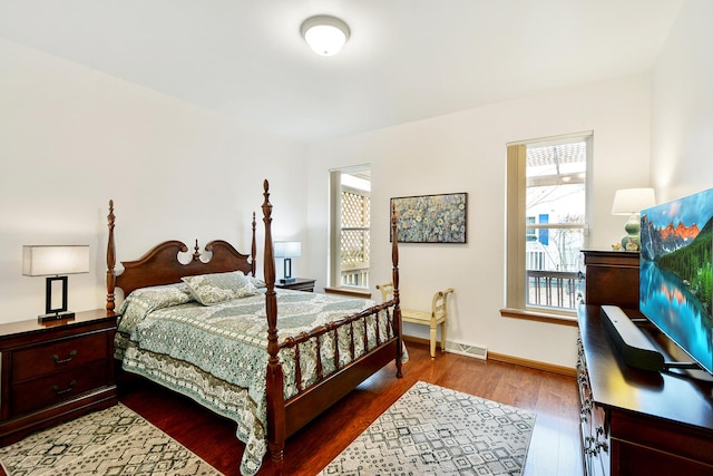 bedroom with hardwood / wood-style flooring