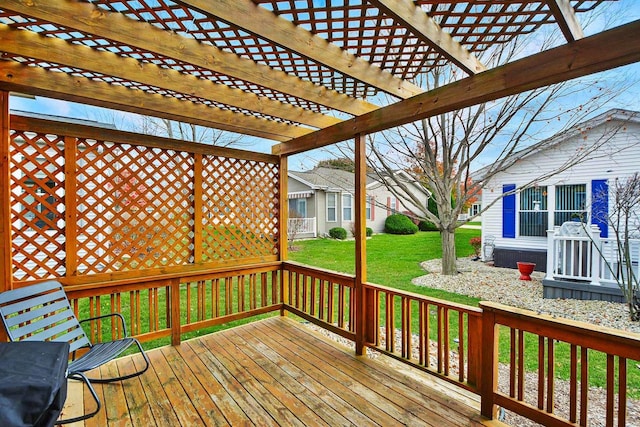 deck with a pergola and a yard