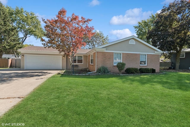 ranch-style house featuring a front lawn and a garage