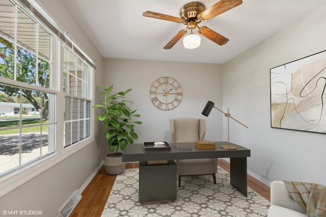 office area featuring light hardwood / wood-style floors and ceiling fan