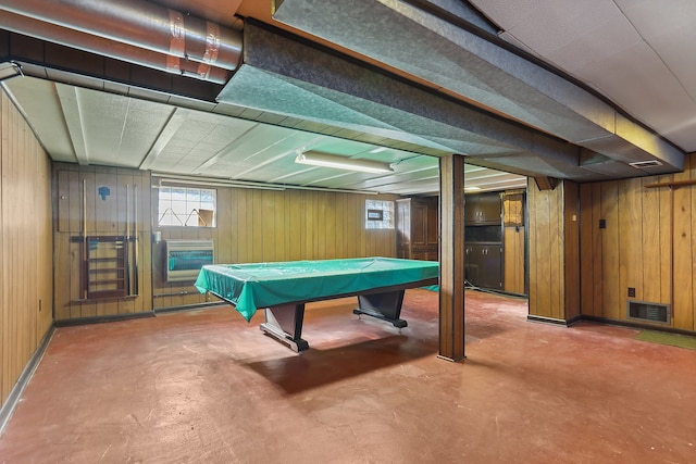 game room with billiards, concrete floors, and wood walls