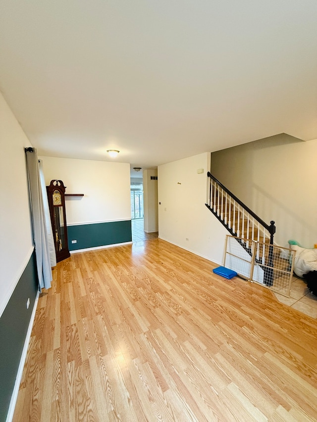 unfurnished living room with hardwood / wood-style floors