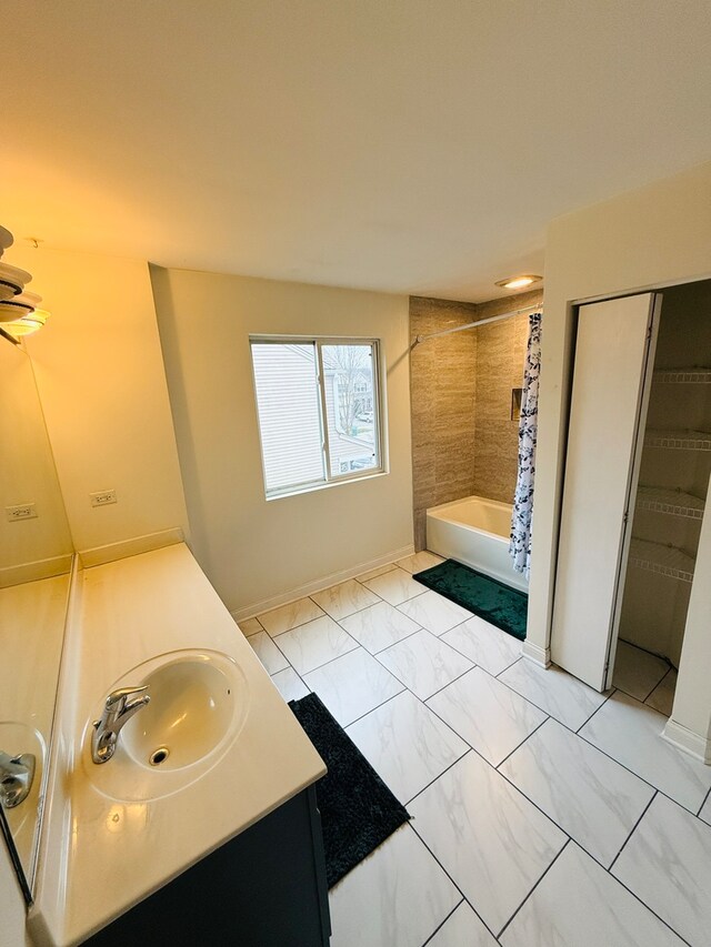 bathroom with shower / tub combo with curtain and vanity