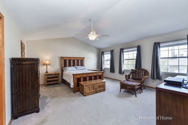 carpeted bedroom with vaulted ceiling and ceiling fan