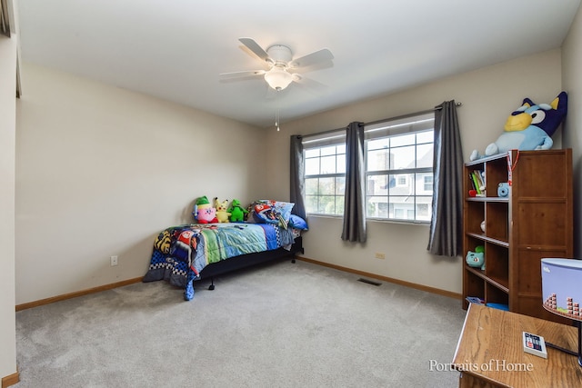 bedroom featuring ceiling fan and carpet