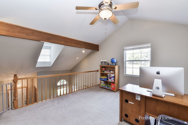 office area featuring ceiling fan, light carpet, and vaulted ceiling with beams