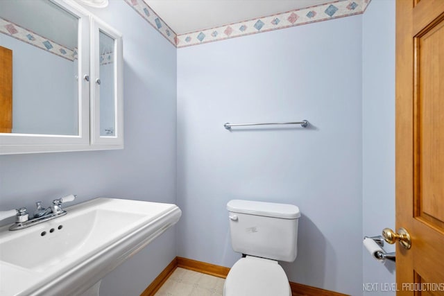 bathroom featuring sink and toilet