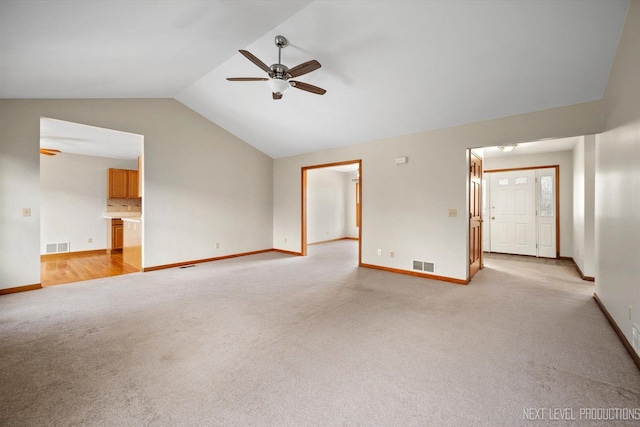 unfurnished living room with light carpet, ceiling fan, and lofted ceiling