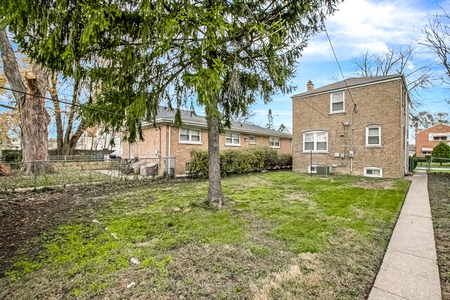 view of yard with central AC unit