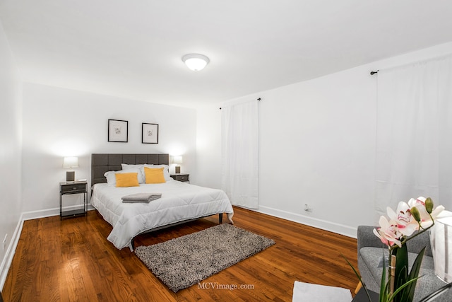 bedroom featuring dark hardwood / wood-style floors