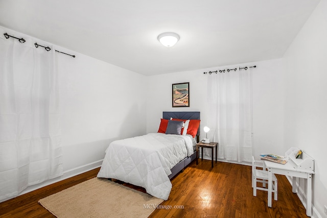 bedroom featuring dark hardwood / wood-style flooring