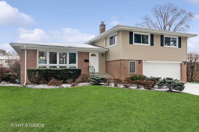 tri-level home with a garage and a front lawn