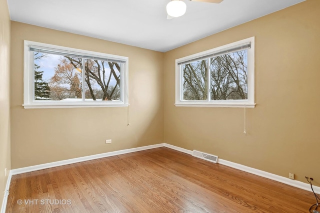 unfurnished room featuring hardwood / wood-style floors