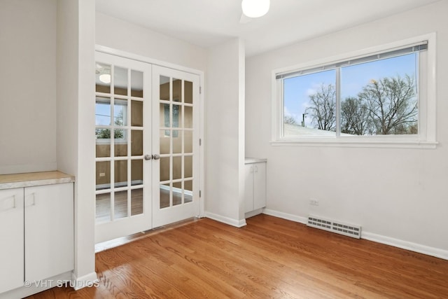 interior space featuring french doors and light hardwood / wood-style flooring