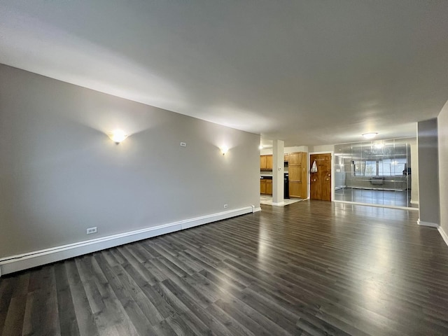 unfurnished living room with a baseboard radiator and dark hardwood / wood-style floors