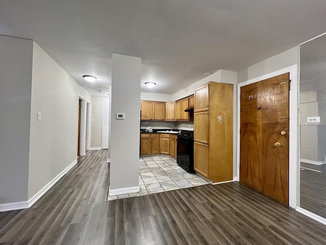 kitchen featuring black stove and light wood-type flooring