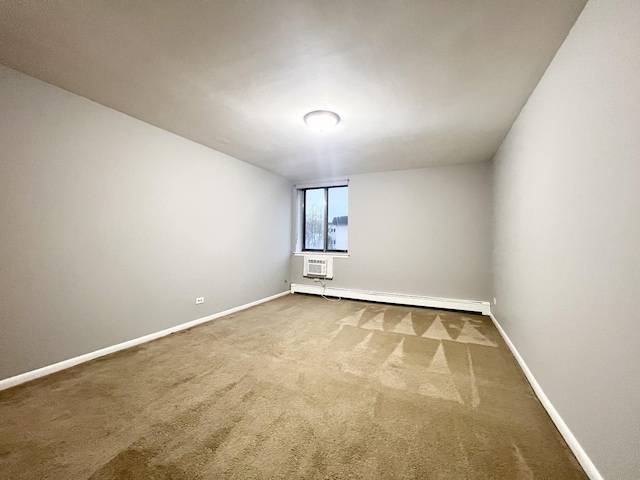 empty room featuring baseboard heating and carpet floors