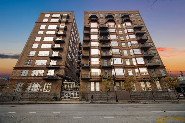 view of outdoor building at dusk