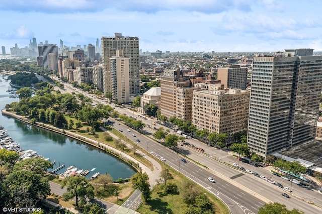 birds eye view of property with a water view