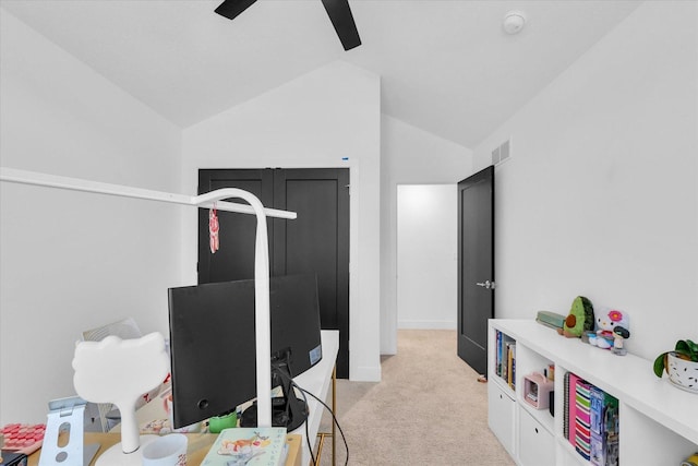 workout room with light colored carpet, lofted ceiling, visible vents, and ceiling fan