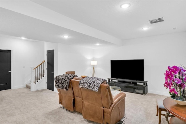 living area with recessed lighting, visible vents, light carpet, baseboards, and stairs