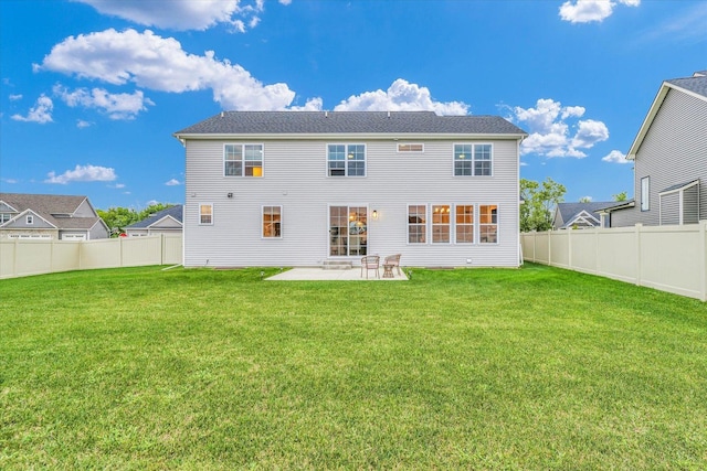 rear view of house featuring a patio area, a fenced backyard, and a lawn