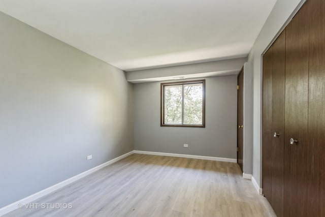 spare room featuring light wood-type flooring