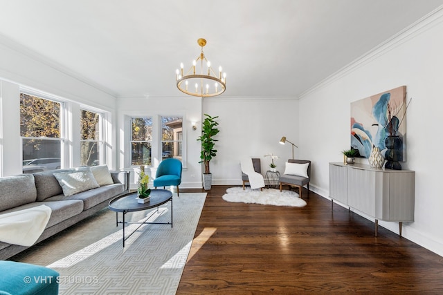 living room with a chandelier, hardwood / wood-style floors, and crown molding