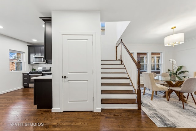 stairway featuring hardwood / wood-style flooring