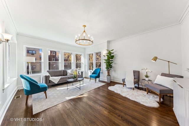 living room with a chandelier, crown molding, and dark wood-type flooring