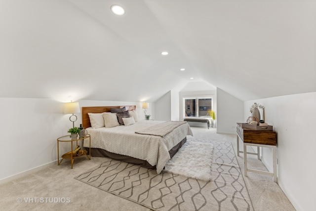 carpeted bedroom featuring lofted ceiling