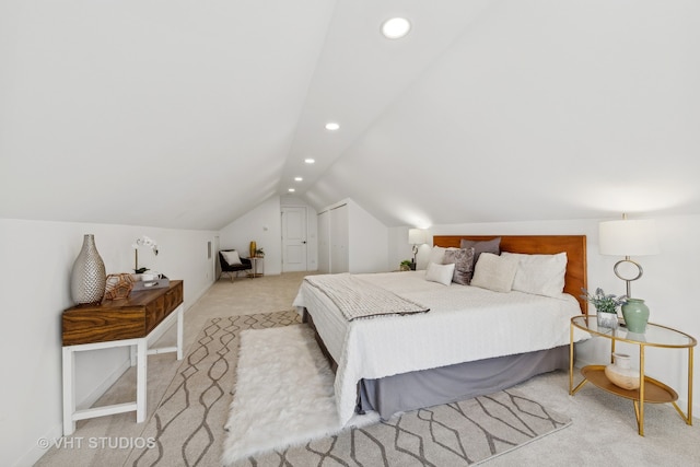 bedroom with light carpet and vaulted ceiling