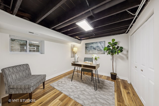 office space with wood-type flooring