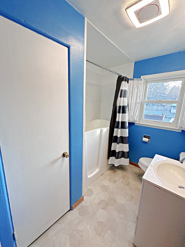 full bathroom featuring vanity, toilet, and shower / bath combo with shower curtain