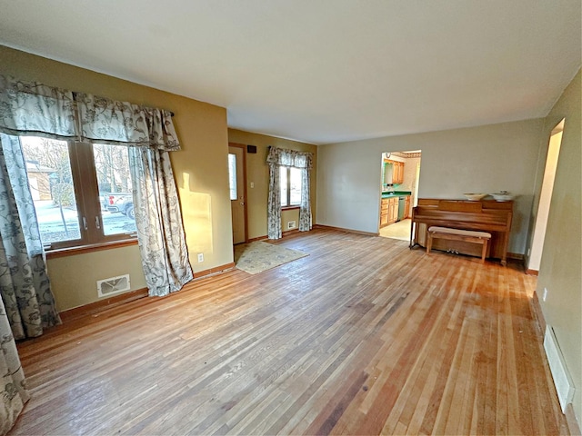 interior space featuring a wealth of natural light and light hardwood / wood-style floors