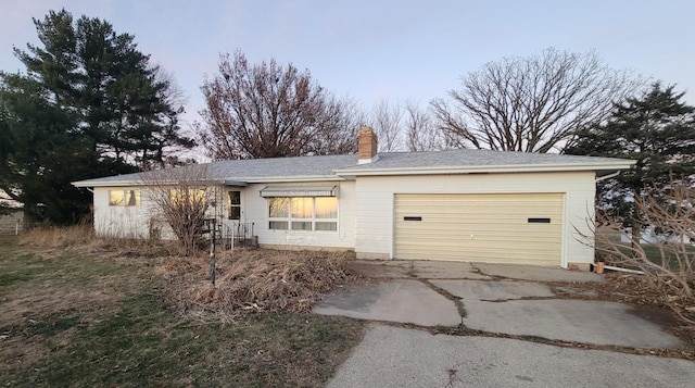 ranch-style home featuring a garage