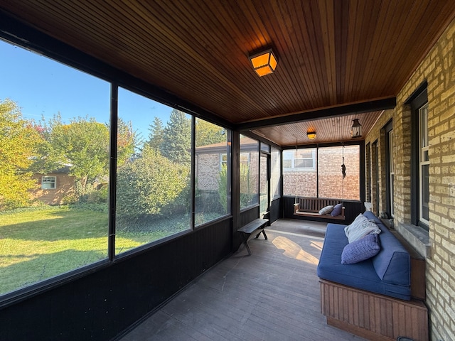 sunroom / solarium featuring wooden ceiling