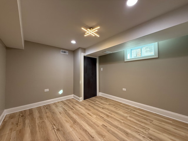 basement featuring light hardwood / wood-style flooring