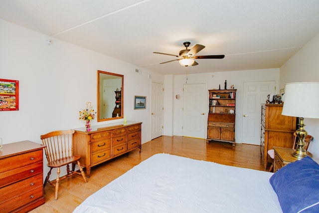 bedroom featuring ceiling fan and light hardwood / wood-style floors