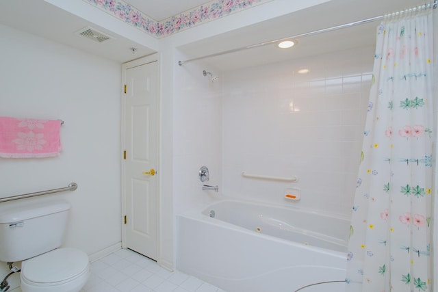 bathroom featuring toilet, tile patterned floors, and shower / tub combo with curtain