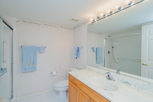 bathroom with walk in shower, vanity, and toilet