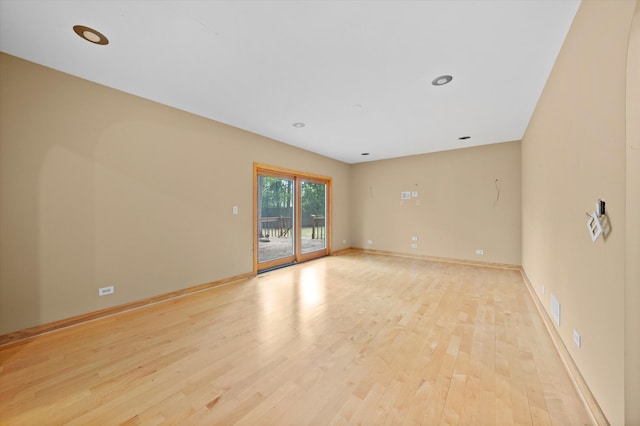 spare room featuring light hardwood / wood-style floors