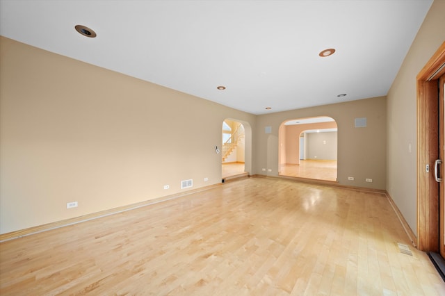 spare room featuring light hardwood / wood-style floors