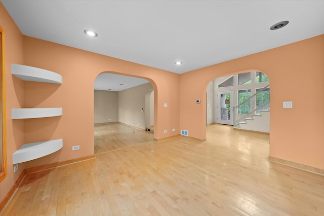 spare room featuring light wood-type flooring