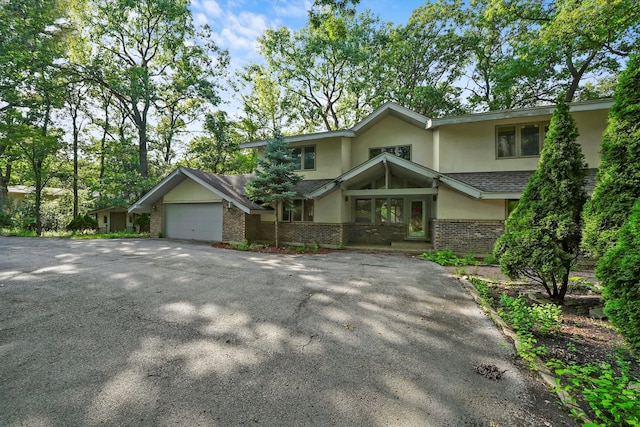 view of front of property with a garage