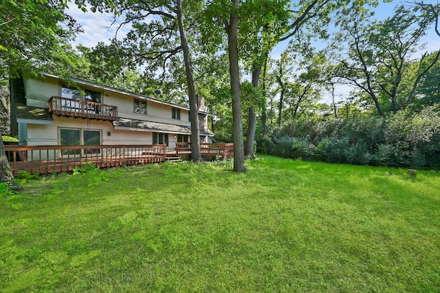 view of yard featuring a balcony