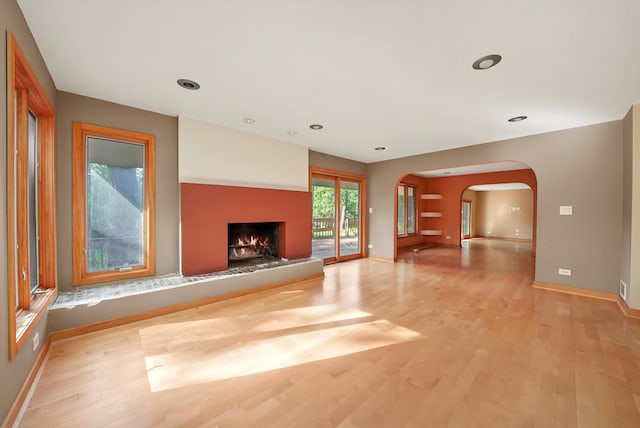 unfurnished living room featuring light hardwood / wood-style flooring