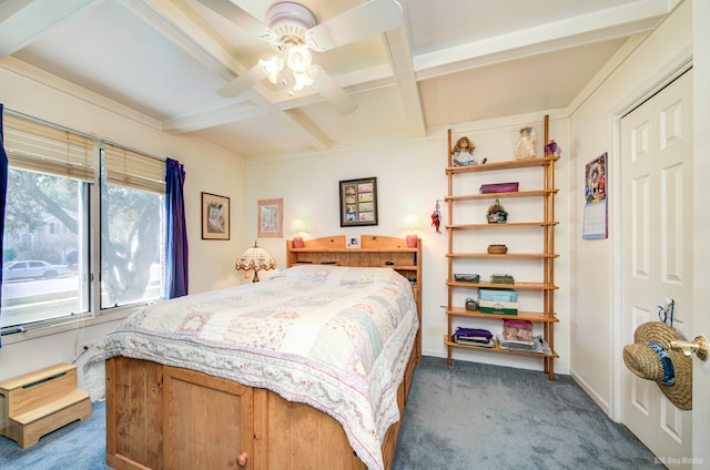 bedroom featuring beam ceiling, ceiling fan, coffered ceiling, and dark colored carpet